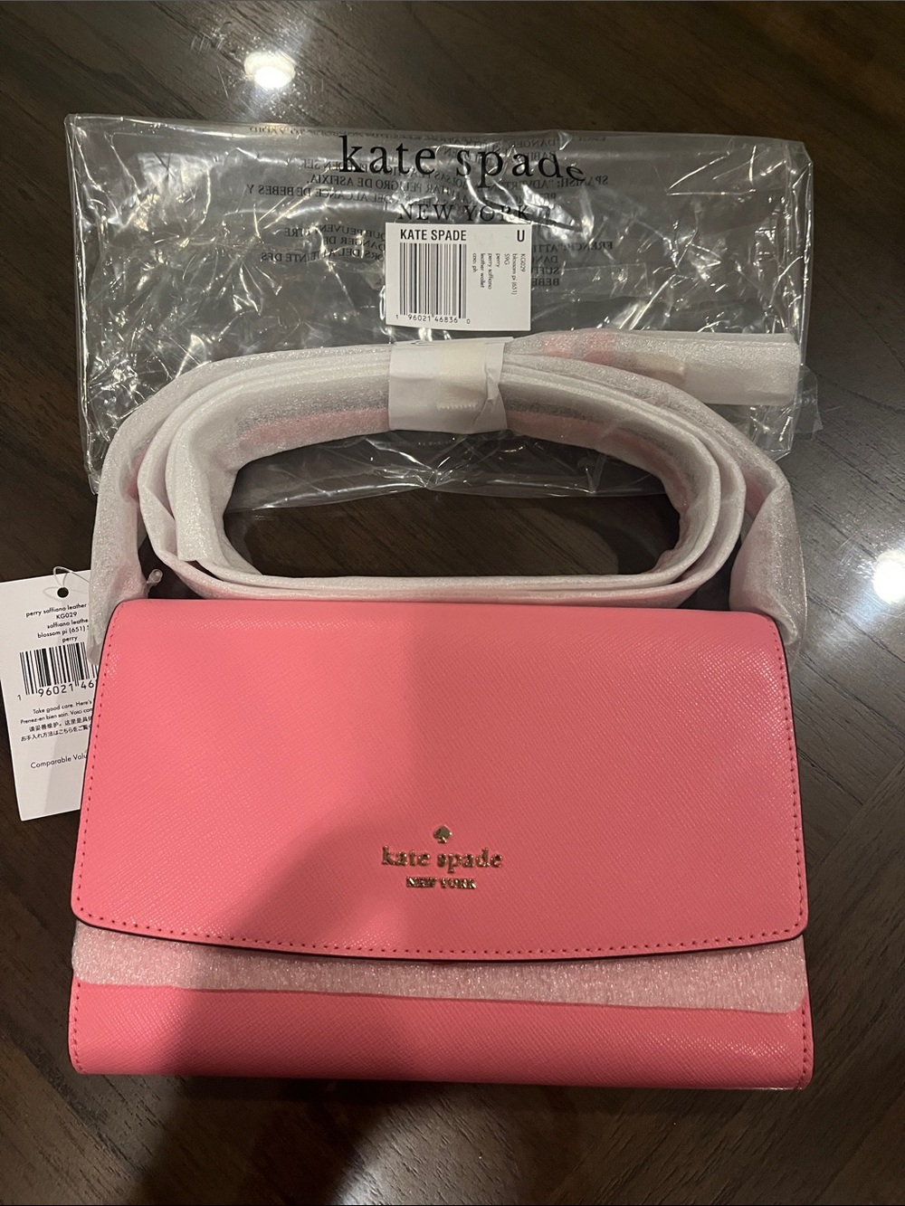kate spade pink crossbody bag with gold logo